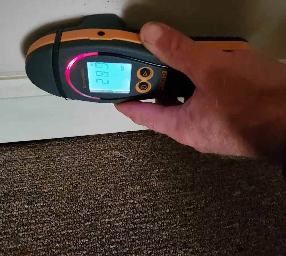 Moisture detection at baseboard during Storm Damage Restoration in South Amboy